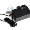 Black power supply adapter with cord and warning label.