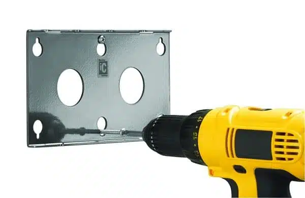 Electric drill installing metal mounting plate.