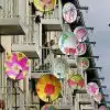 Colorful satellite dishes on apartment balconies.