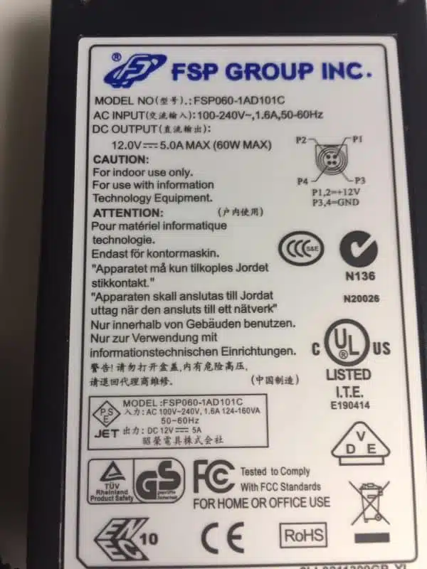 Power adapter label with safety and regulatory information.