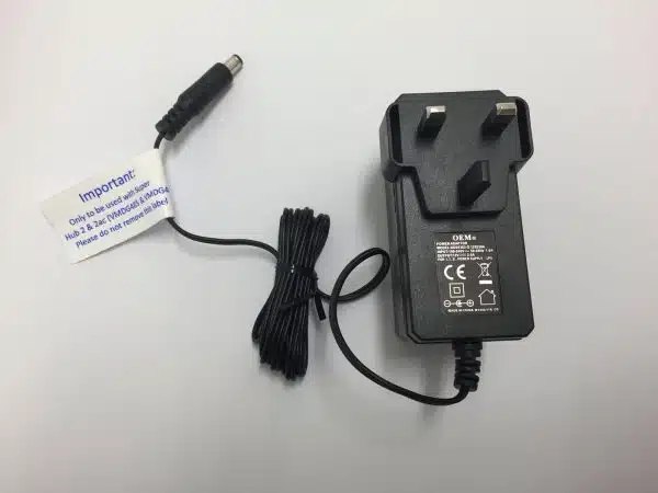 Black power adapter with warning label.