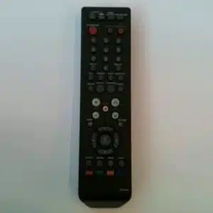 Black universal TV remote control on white.