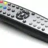 Black universal TV remote control with colored buttons.