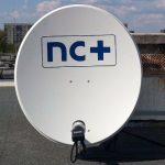 NC+ satellite dish on rooftop.