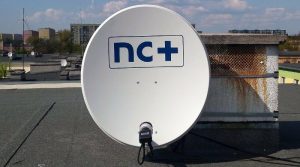 NC+ satellite dish on rooftop.