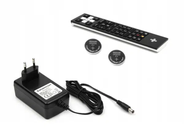 Universal remote control, power adapter, and button cell batteries.